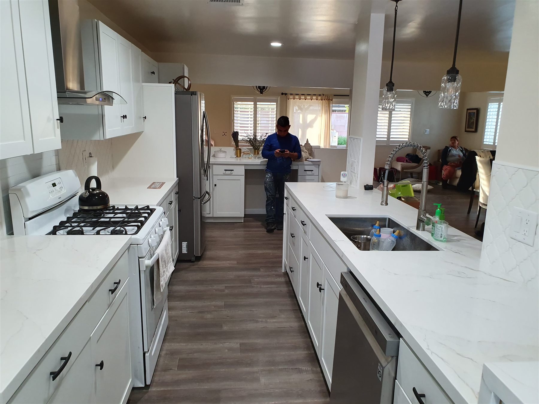 Completed white kitchen remodel with island